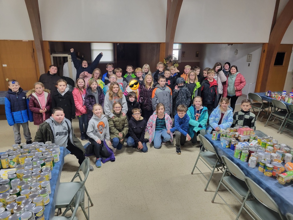 4th grade students delivering cans to St. Patrick's Church